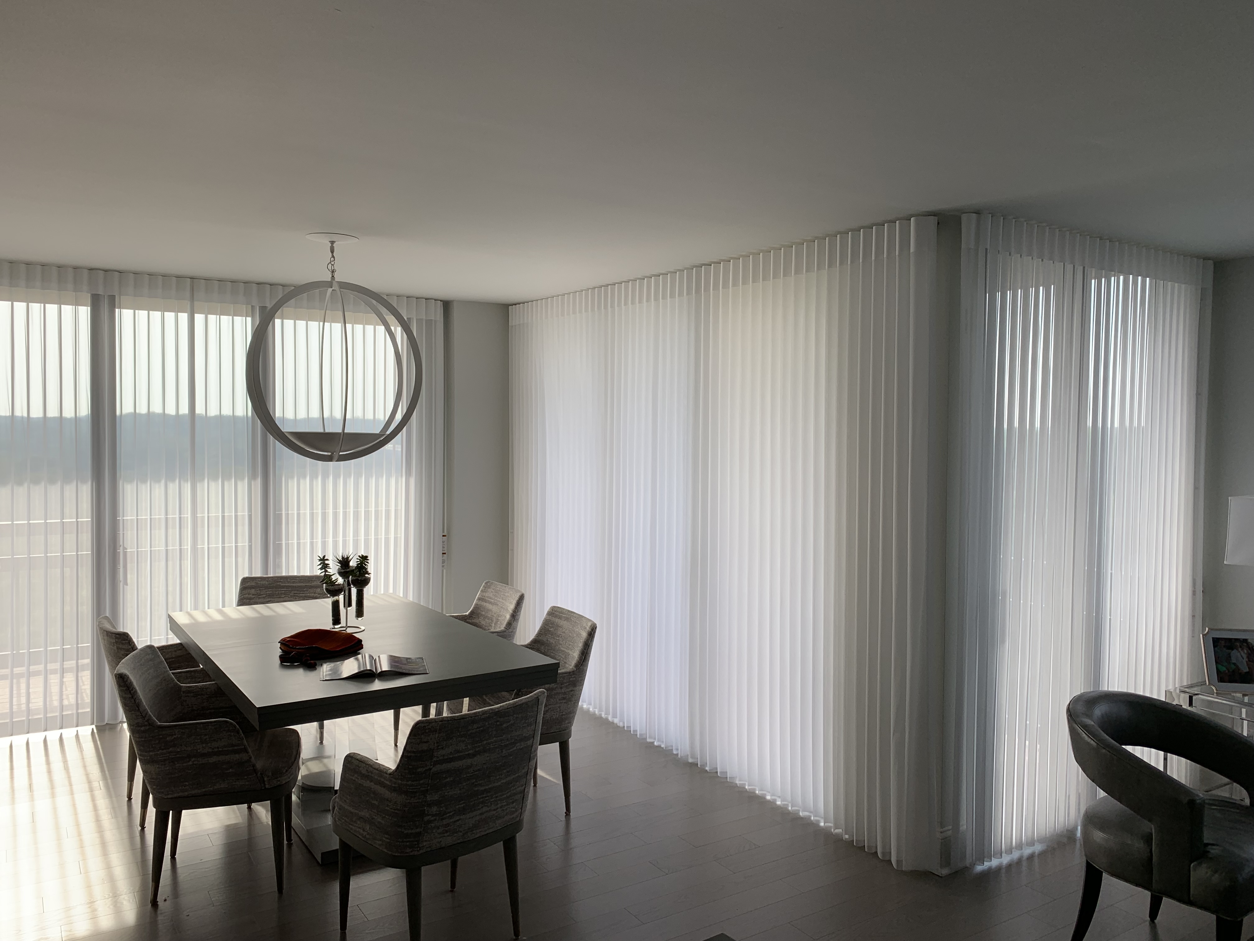 Luminette sheer verticals across a corner dining room