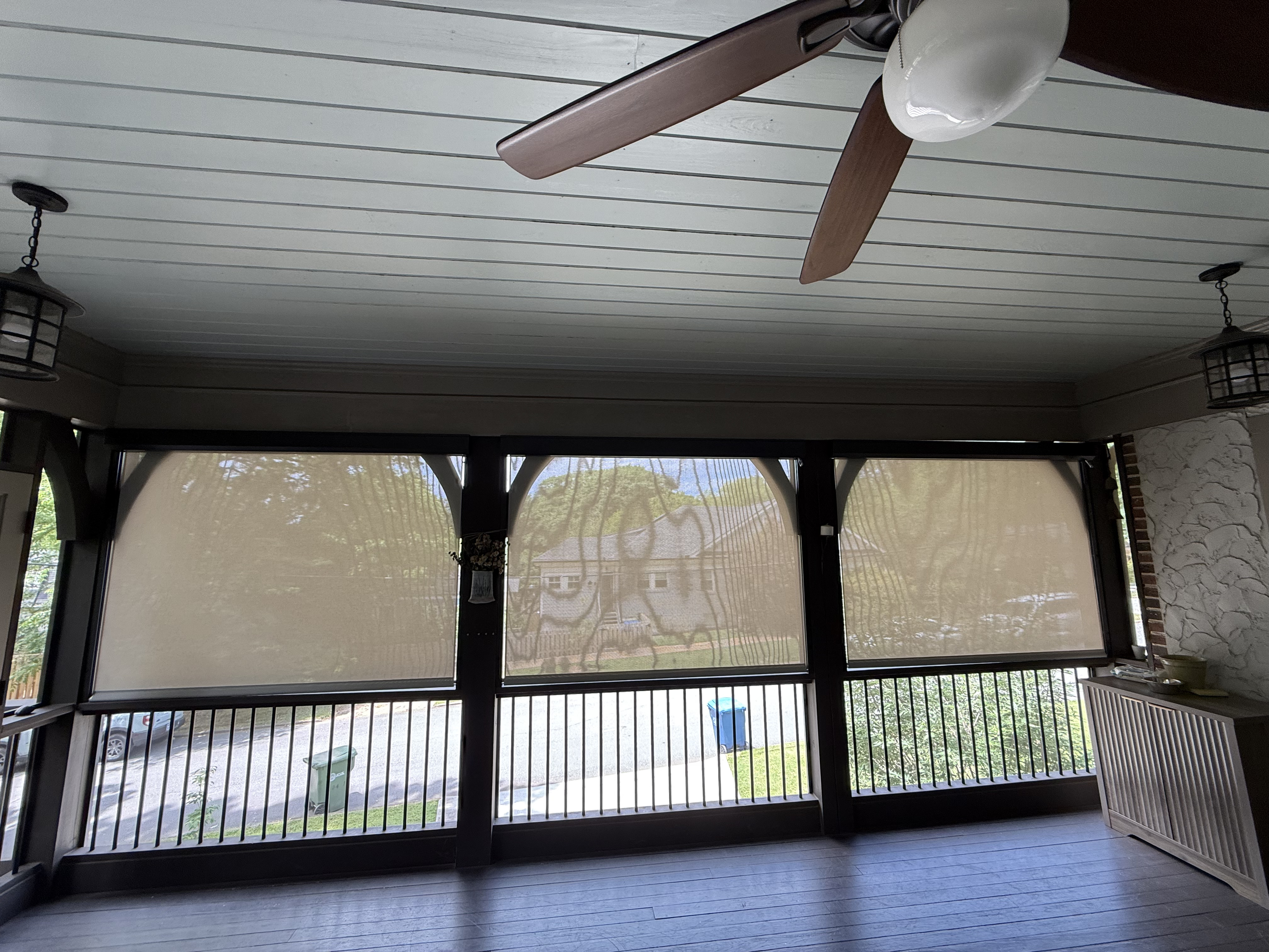 Motorized exterior porch screens lowered