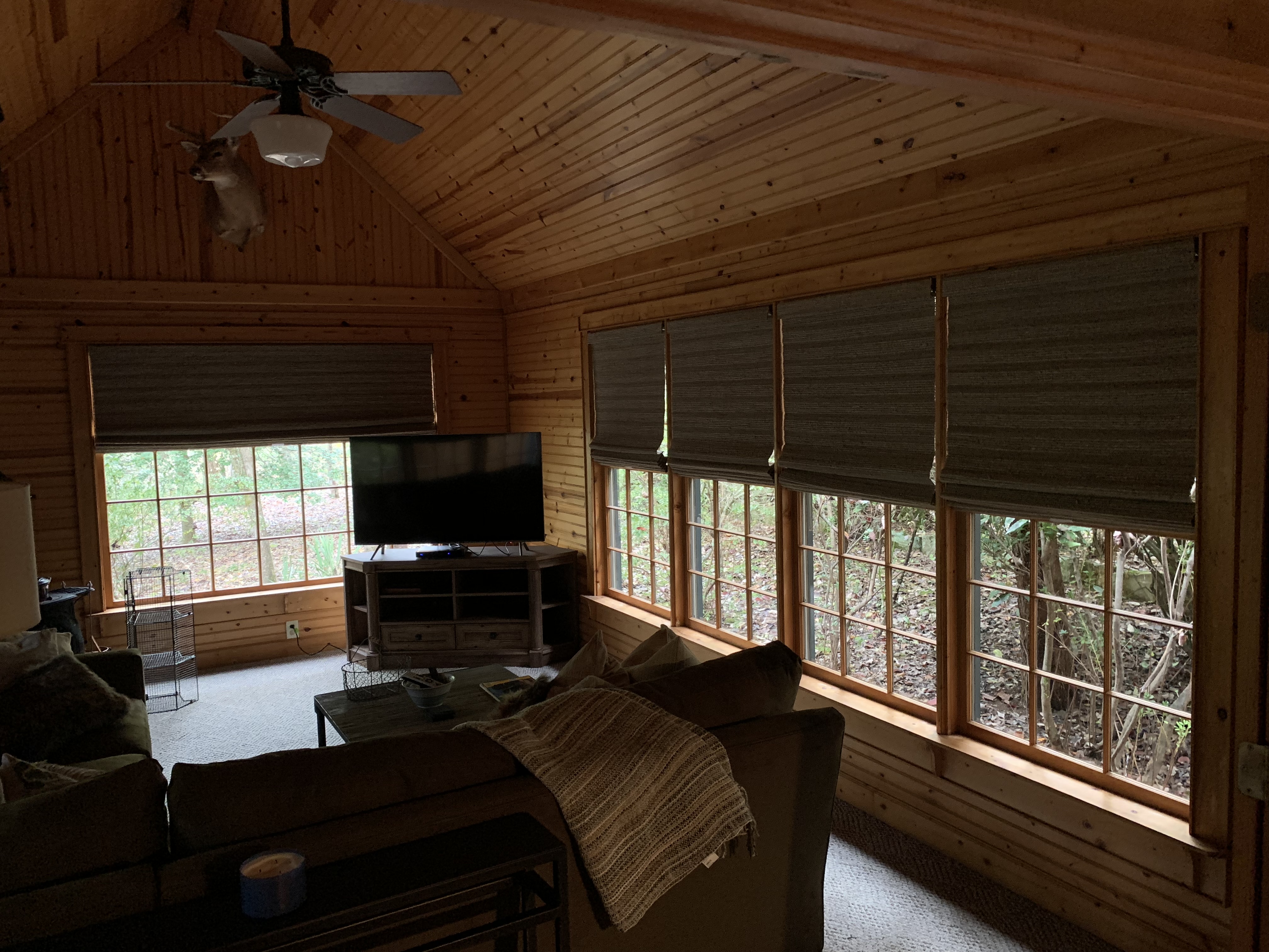 Woven wood shades in a cabin great room
